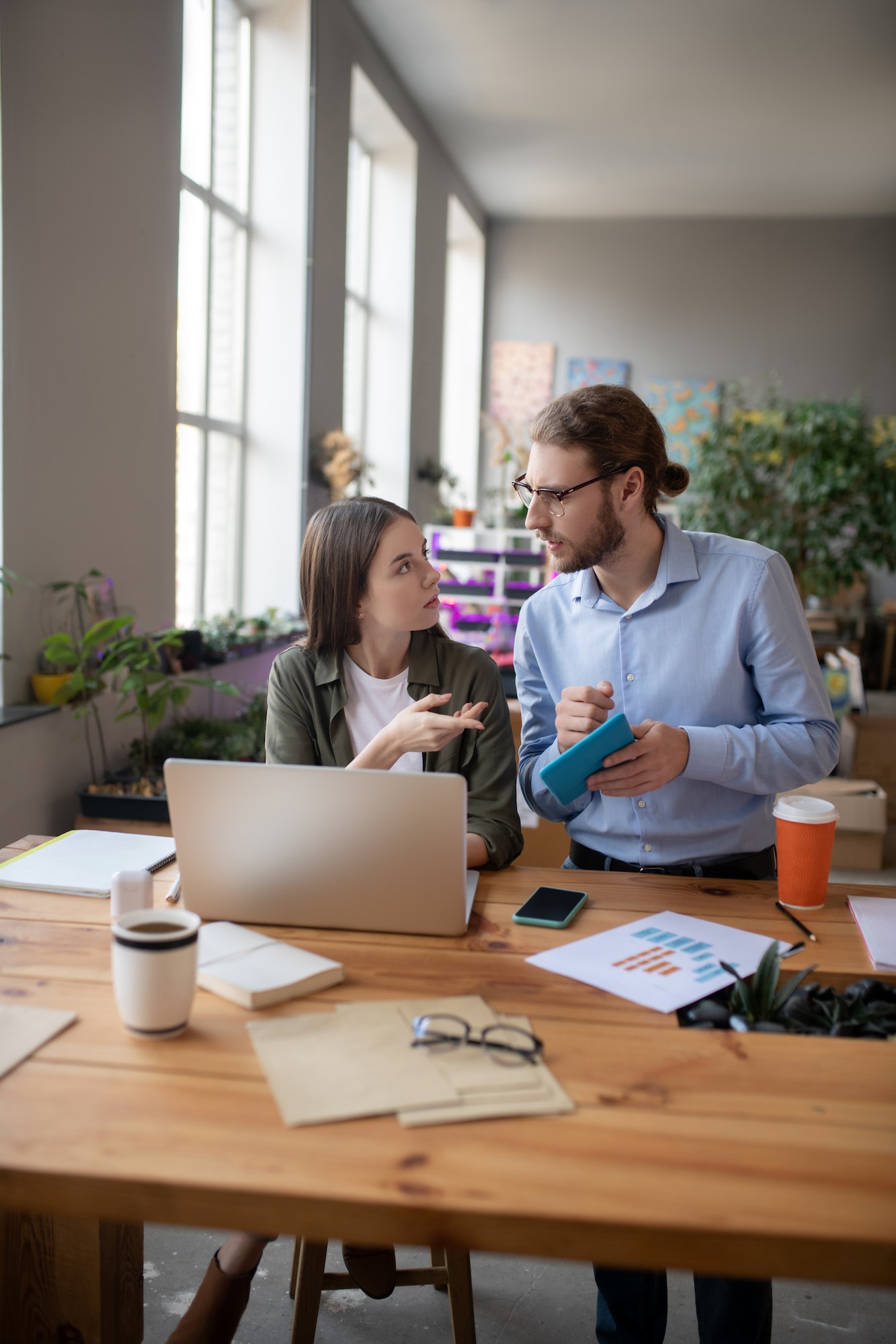 Business partners girl and man discussing their project.